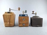 three different types of coffee grinders and a coffee grinder