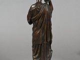 pair of bronze statues of a man and a woman