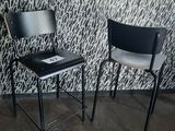 two chairs that are next to each other in a room