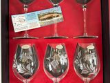 six wine glasses in a box with a price tag on them