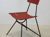 an image of a red chair with a basket on the back