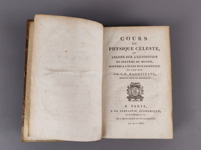an open book with a picture of a coat of arms on top of it