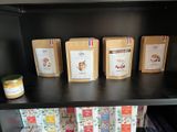 many bags of food on a shelf in the kitchen