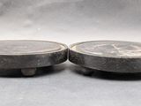 two pieces of stone sitting on top of each other