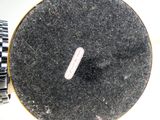 a close up of a watch on a table