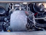 a picture of a car engine with the hood open