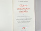 an open book with a picture of a woman ' s face on it