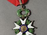 an image of a medal with a ribbon around it on a table