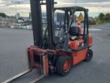 a forklift that is parked in a parking lot