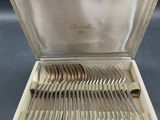 silver plated flatware in a case with handles and handles