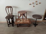 three chairs and a table in the corner of a room