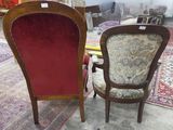 two chairs that are next to each other in a room