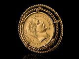 a close up of a gold coin with a rope around it