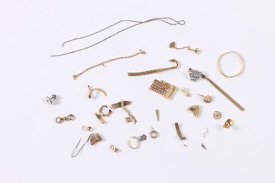 many different types of jewelry on a white surface