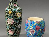 two vases sitting next to each other on a table