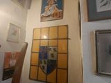 many pictures on the wall in this room