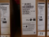 boxes of acer products are stacked on a shelf in a store
