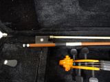 a violin in a case with a bow in it