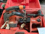 a red tool box with tools in it on a table