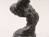 a bronze sculpture of a rabbit on a black base