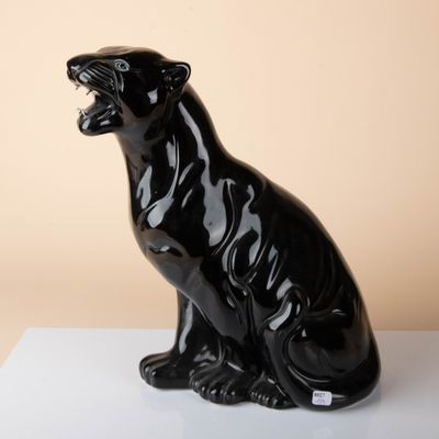 an image of a black panther statue on a white surface