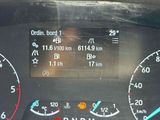 a close up of a car dashboard with various gauges