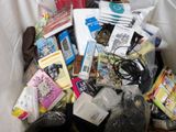 a pile of assorted items in a bin on the floor