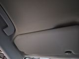a close up of a car door handle with a phone in it