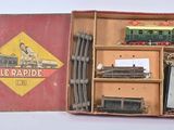 a small box with a train set inside of it