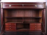 an image of a wooden desk with drawers and a bookcase