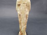 an egyptian statue of a woman holding a baby in her arms