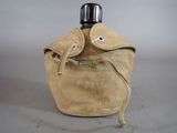 a brown bag with a bottle in it on a table