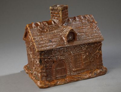 Pot rectangulaire, uniformément brun, représentant une maiso…