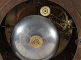 a clock that is sitting on a table in the room