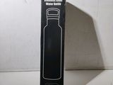 a black box that has a black bottle in it