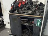 a pile of assorted items on the floor in a garage