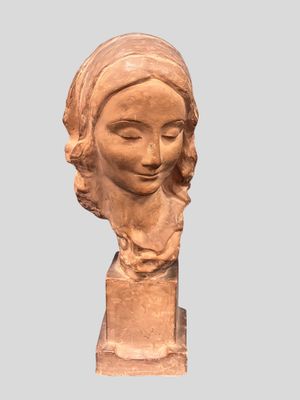 statue of a woman ' s head with a scarf on her head