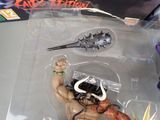 a action figure of a man with a sword in his hand