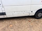 a van that has been vandalized with bullet holes on it
