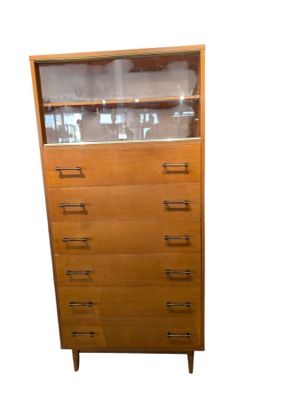 a tall wooden cabinet with a glass top