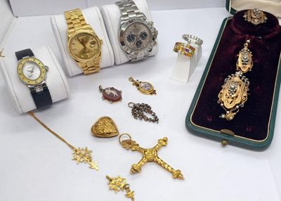 many different types of watches and jewelry on the table