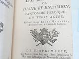 an open book with a picture of a coat of arms on it