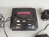 a black cassette player and headphones on a white table