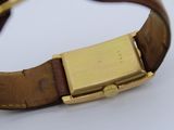 an image of a close up of a wrist watch on a white surface