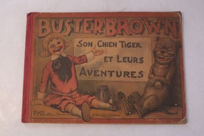 un vieux livre sur lequel figure l'image d'un garçon et d'un ours