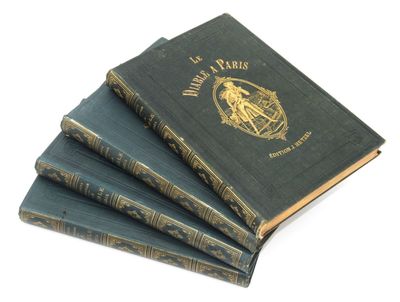 trois livres sont empilés sur une surface blanche
