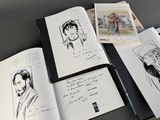 a lot of drawings on the pages of a book