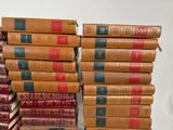 books stacked on top of each other on a white surface