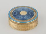 an image of a gold and blue box sitting on top of a white table