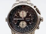 a close up of a watch on a white surface